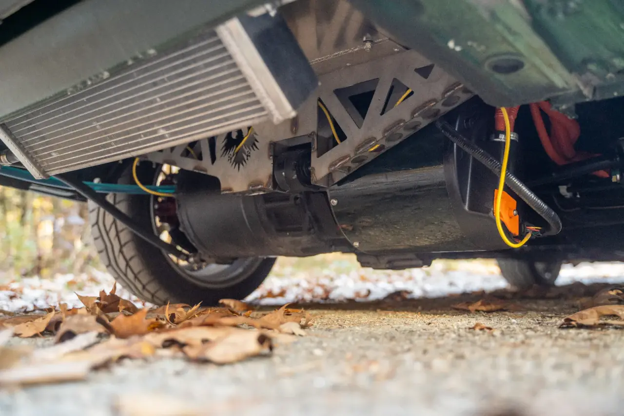 Skudak BMW E30 electric drivetrain — motor, battery, and high-voltage wiring